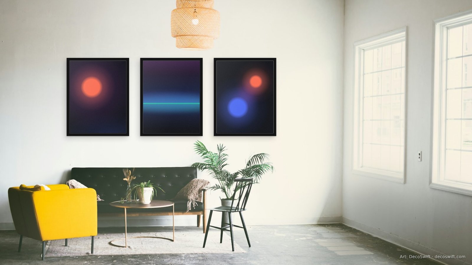 Video call background: Three Chromatic Drift prints in black frames on a white studio wall above a dark sofa and a yellow armchair.